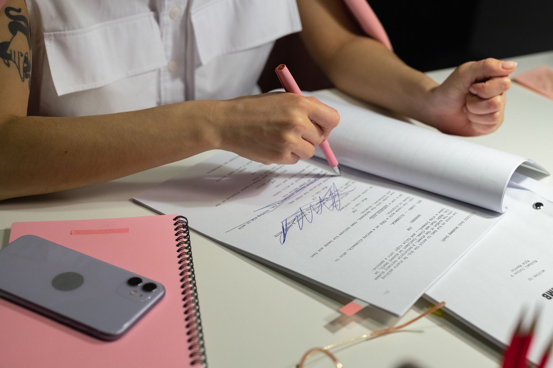 A stack of stamped documents on a desk.