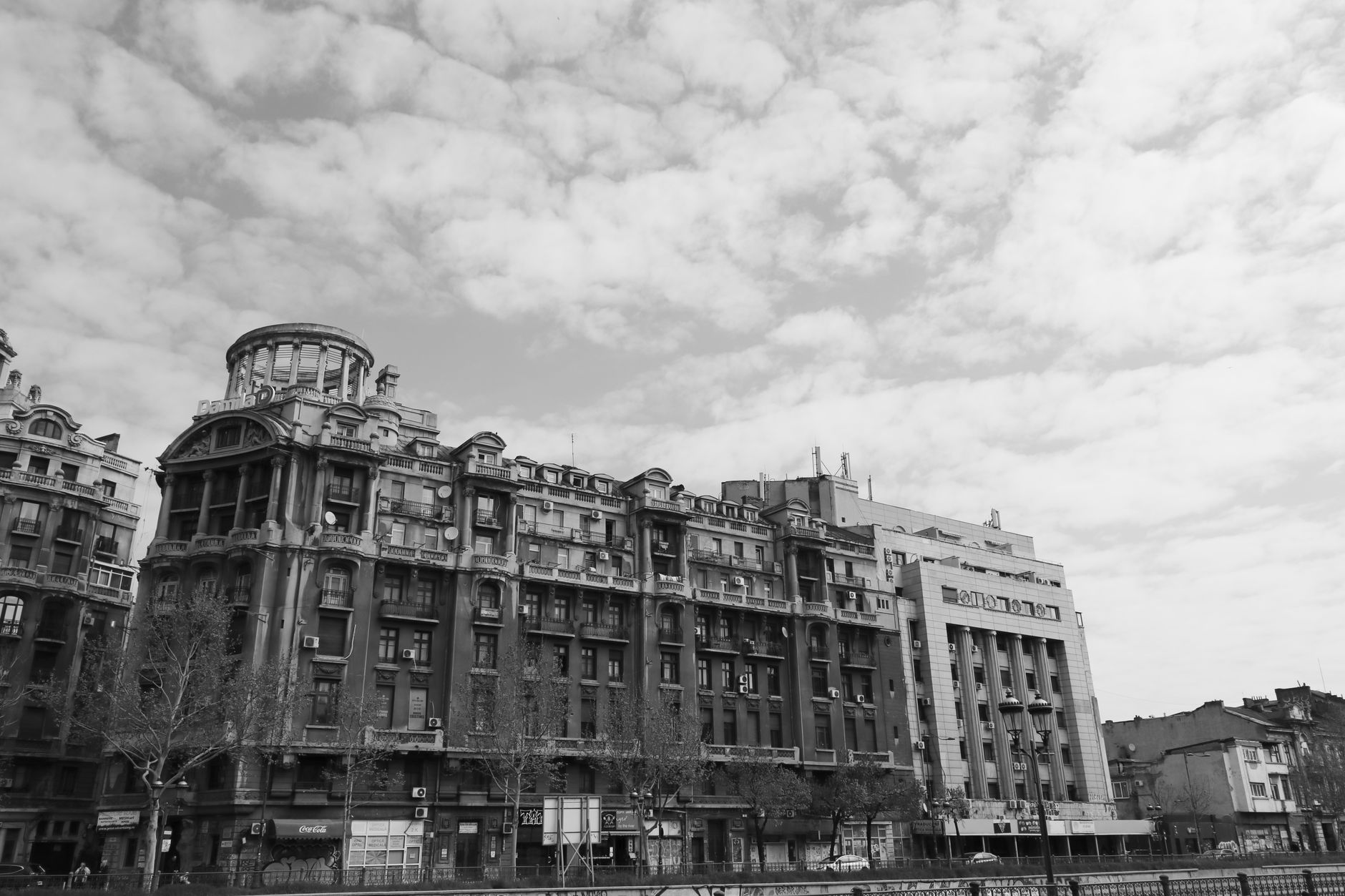 Period buildings along a street in Bucharest in daylight.