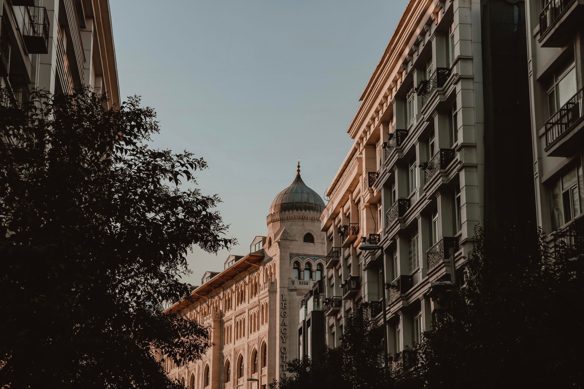 City buildings in Bucharest under a daylight sky.